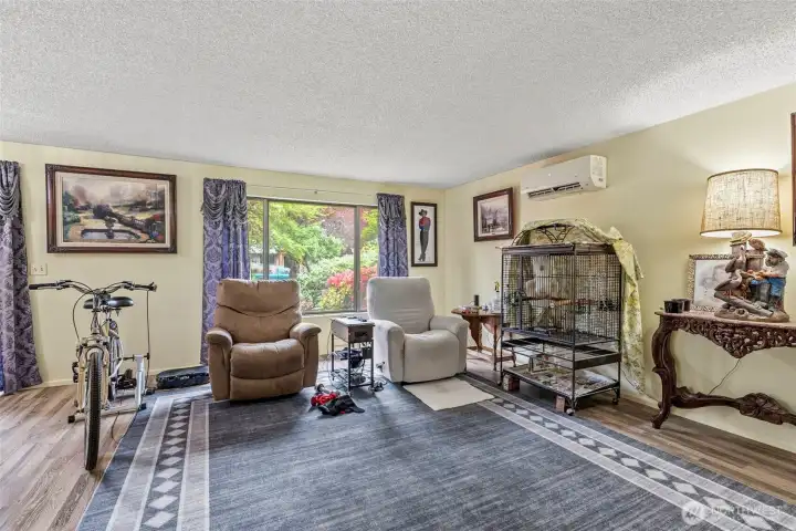 Comfortable living area with updated flooring and natural light