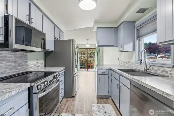 LG stainless appliances and new sinks, faucet and cabinet hardware and updated lighting.