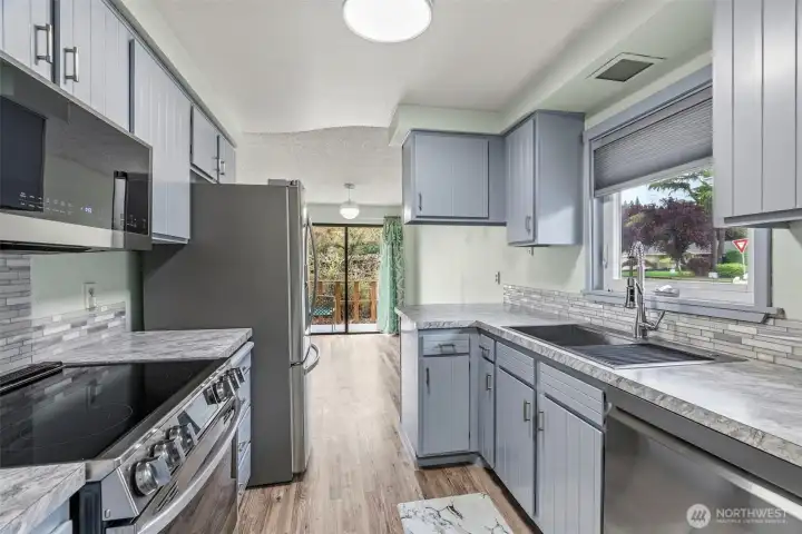 Freshly updated kitchen with new appliances and stylish fixtures