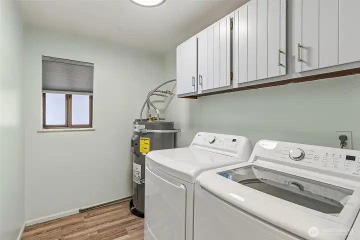 Convenient in-unit laundry adding everyday functionality with added storage and new 50 gallon hot water heater. LG large capacity washer and dryer that is included in the sale.