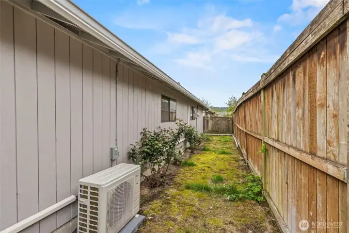 back of the units along the fence.