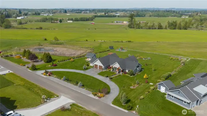 Aerial view of property and home