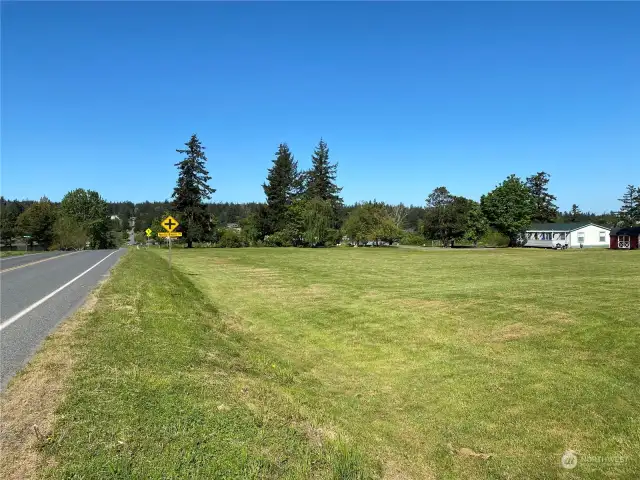 From Lot 3 across Lot 4. Lot 1 includes house. Looking west towards the Port of Orcas. Mount Baker Road on left.
