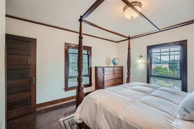 More wood-wrapped window in the upper floor bedroom