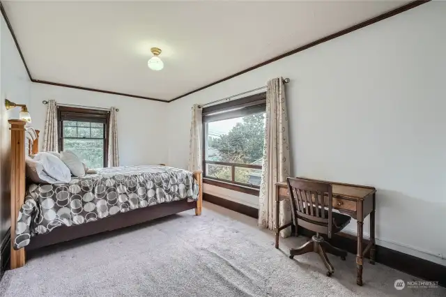 3rd large upper floor bedroom with timeless wood-wrapped windows