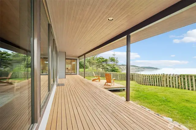 A covered porch runs the length of the house - enjoy the birds, the water traffic, the views, the beauty.