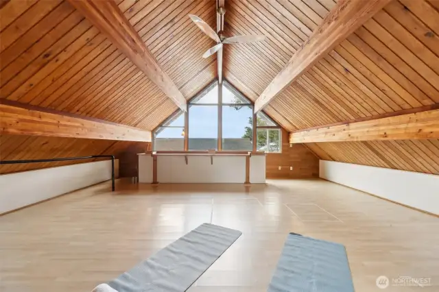 Large loft with beautiful wood detailing and cathedral ceiling. Work from home, bunk room, exercise or project space - how would you use this loft?