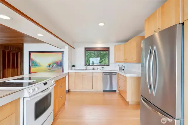 Spacious kitchen with natural light and abundant storage.