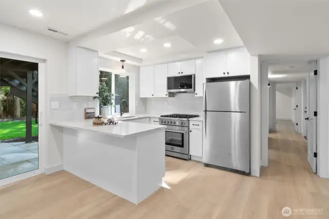 Second full kitchen downstairs is perfect for potential MIL or ADU.