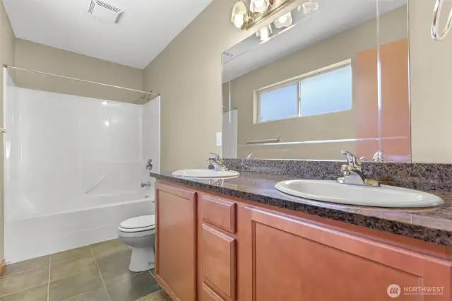 Master bathroom with granite countertops and double sinks
