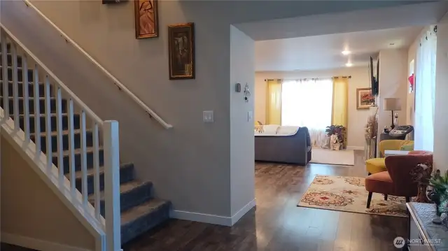 The front entry is very wide and the 5th bedroom is to the left near the staircase.