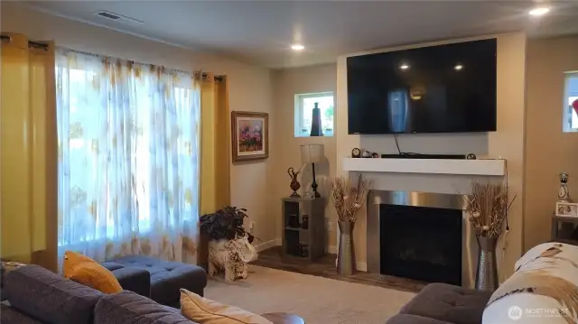 The living room has a view of the backyard