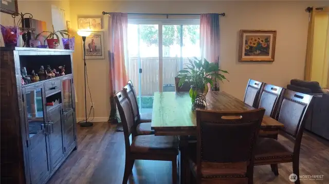 There is plank flooring in the dining room, kitchen, living room and front entry.