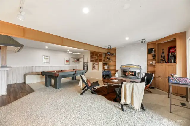 Bonus room with wood fireplace and built in shelves