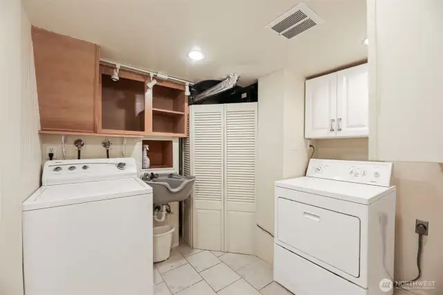 Main laundry room with sink.