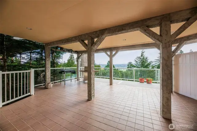 Huge covered deck outside the finished basement