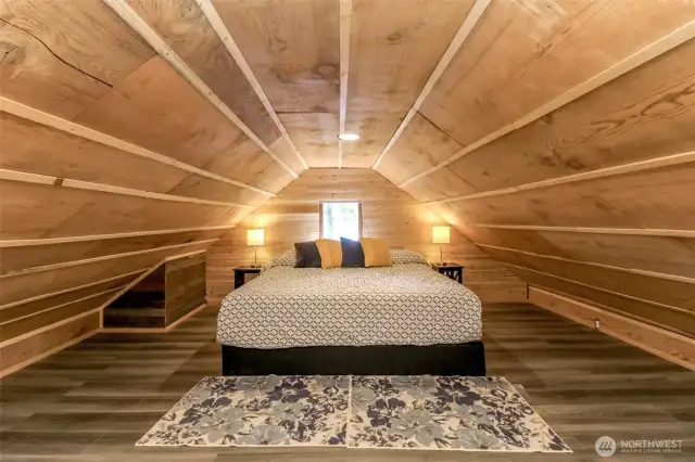 Loft area fits king size bed comfortably with dresser
