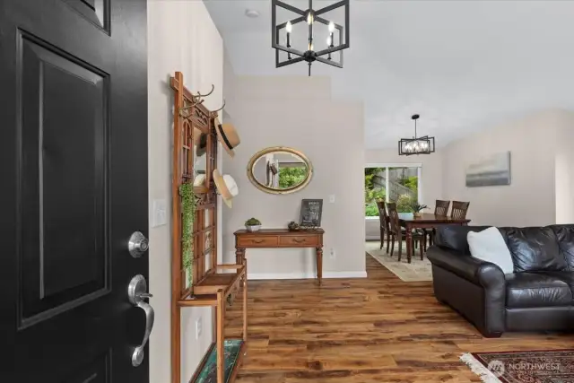 Vaulted ceilings adorn the entry into the home, with a sitting area and formal dining space. It's all a flex space to use as your heart desires!