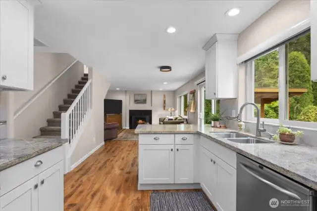 Functional kitchen space with peninsula. Perfect for your charcuterie spread and appetizers when hosting!