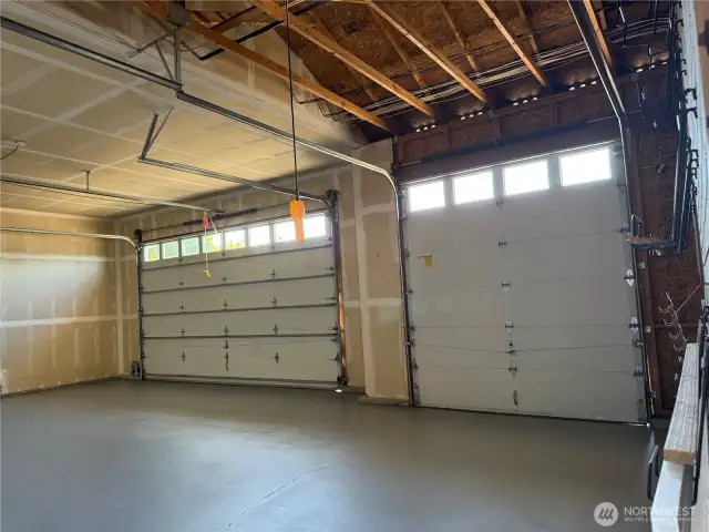 over 12 feet tall 3 car garage with new painted floor