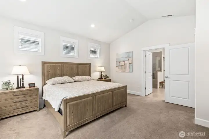 Primary suite is large spacious and bright with vaulted ceilings. Feels like you are at a resort.  Makes every day feel like a vacation!
