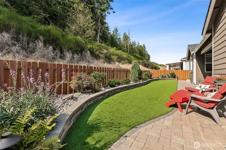 Custom Pavers and curbing and turf make this yard easy to maintain.