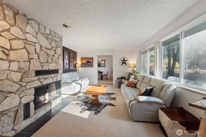 Formal living room is a great space to unwind. The wood burning fireplace offers ambience and the perfect spot to relax with a good book.