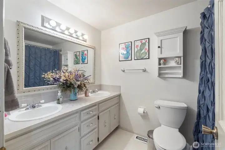 Full guest bathroom located on upper level.
