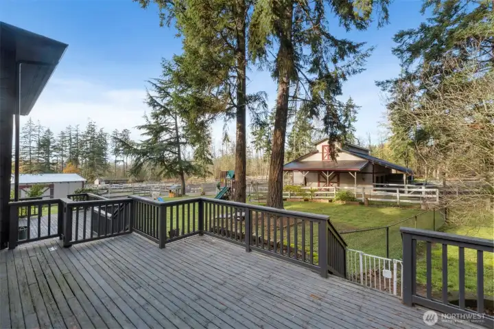 Imagine enjoying your morning coffee on the spacious deck while taking in views of the barn, animals and surrounding grounds.