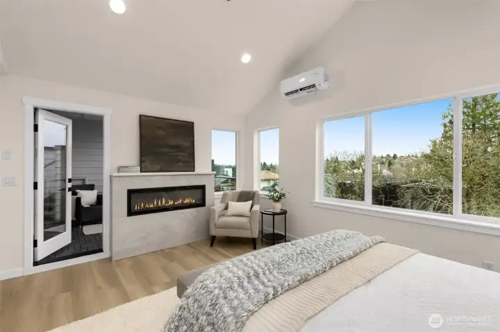 Upstairs- the primary bed features a gabled ceiling adding an open feeling.