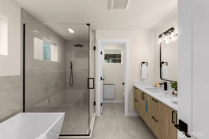 Primary bath features the same level of detail and craftsmanship as the rest of the home. Full tile surround shower with full glass entry & wall. Standalone tub, & separated room for the toilet
