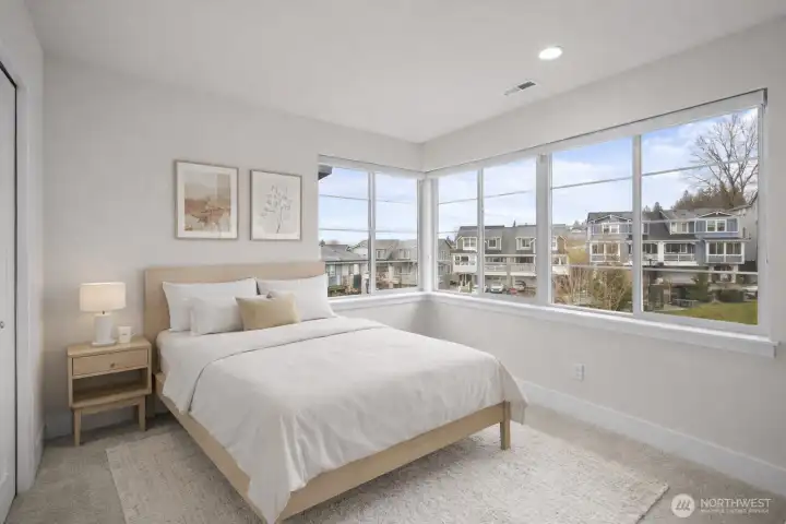 Both rooms enjoy a peaceful outlook, creating bright, calming spaces to relax or work from home.