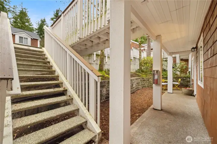 The stairs to your home. While a lower level might seem inferior, it creates privacy. Your front windows open to a private patio, not a parking lot or other units.