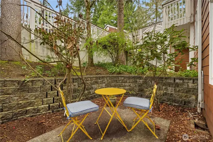 The stairs to your home. While a lower level might seem inferior, it creates privacy. Your front windows open to a private patio, not a parking lot or other units.