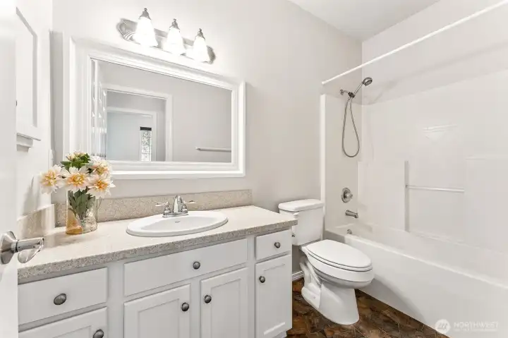 Full bath across the hall from guest bedroom.