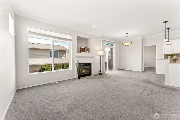Light & bright main room w/a cozy fireplace