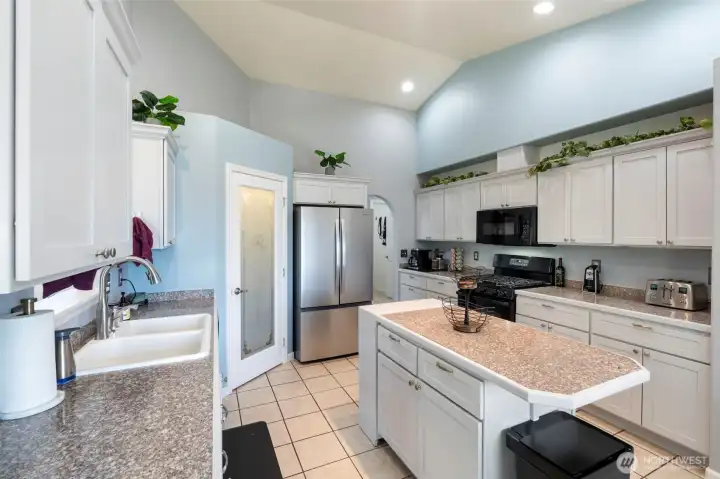 Walk in pantry with new fridge.