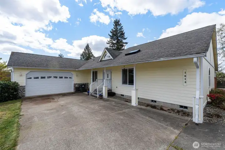 Nice covered front steps with ample room or parking.