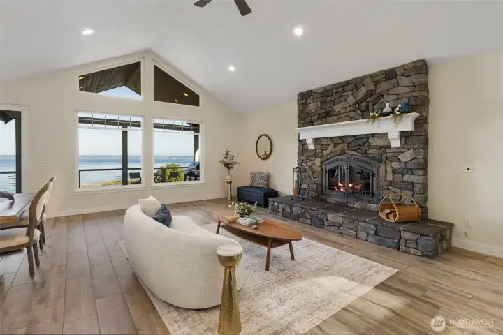 Vaulted ceilings, stone fireplace, in floor radiant heat tile floors and endless views!
