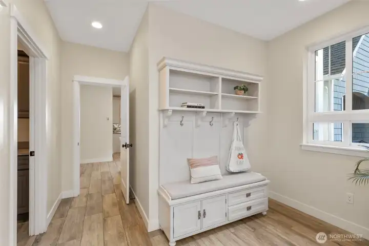 Expansive mudroom off 3 car garage...proper main floor laundry room to the left.