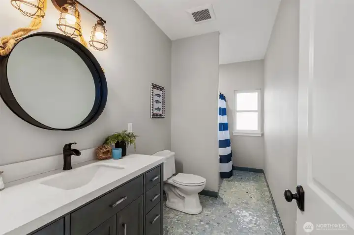 2nd lower level full bath with gorgeous custom tile floors...must see in person!