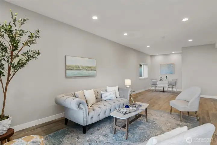 Another shot of lower level living space/ rec room with water views and covered patio access.
