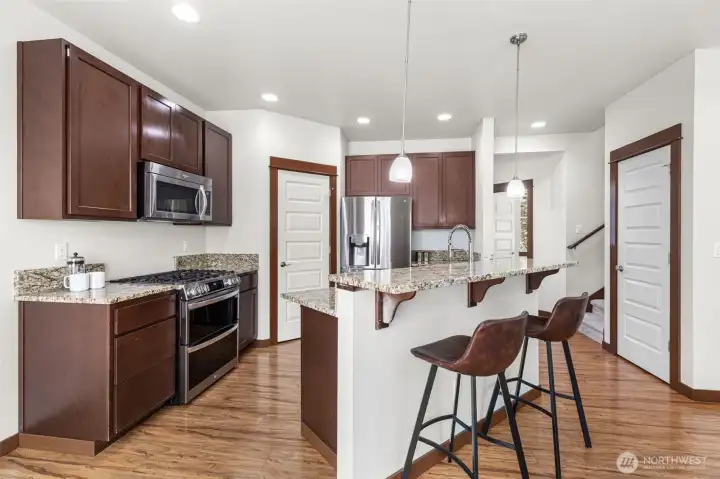 High ceilings offer a light and bright living/kitchen area