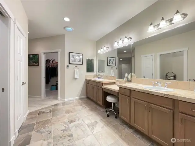 Built-in full-length mirror; Separate toilet room; Linen closet; Heated tile floors.