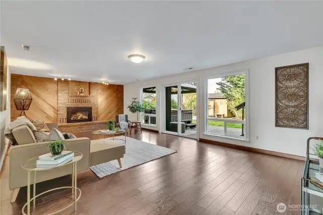 Family room with newer laminate flooring and gas fireplace