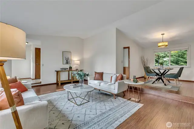 View of entryway, living room, and dining room