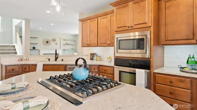 Yes, you're cooking with gas here - literally and figuratively. This kitchen is dialed in with a gas range for precision cooking, an oversized microwave that handles it all, and a jet spray faucet that makes cleanup a breeze. Everything you need, right where you want it.