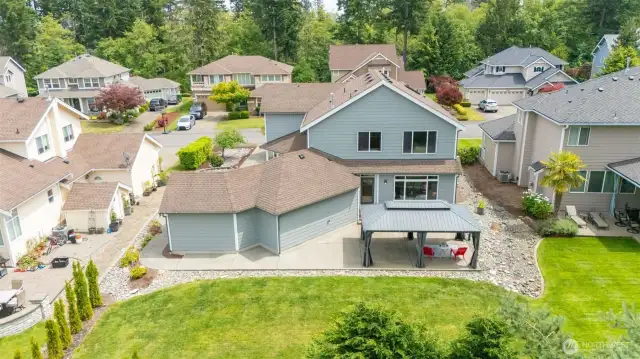 The back yard is an entertainer’s dream, with a HUGE patio that’s ready for BBQs and gatherings, an extra-large gazebo for shade and shelter, and a flat, sprawling lawn that’s perfect for play, pets, or just soaking up the sun.