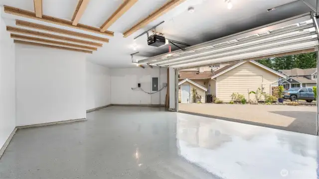 The sleek epoxy floor in the garage is a total game changer - durable, easy to clean, and giving off major showroom vibes. It’s not just practical, it elevates the whole space and makes even your garage feel polished and put together.