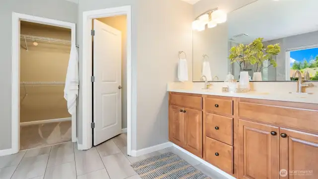 The ensuite bathroom features gorgeous finishes throughout - tile flooring underfoot, sparkling new quartz countertops, sleek high-arch faucets, and a large walk-in closet that makes staying organized feel effortless. It’s equal parts luxury and function.